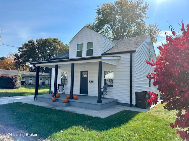 view of front facade with a porch and a front yard