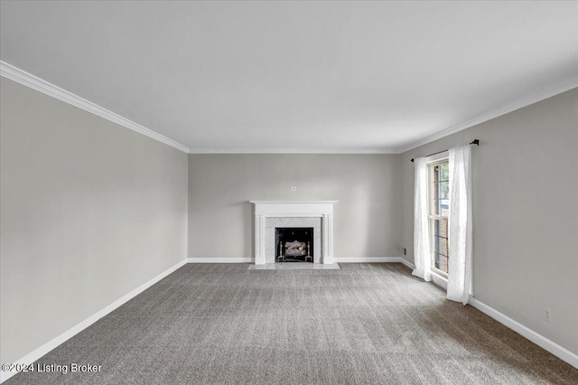 unfurnished living room featuring carpet floors and ornamental molding