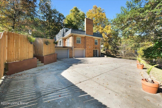 view of side of property with a garage