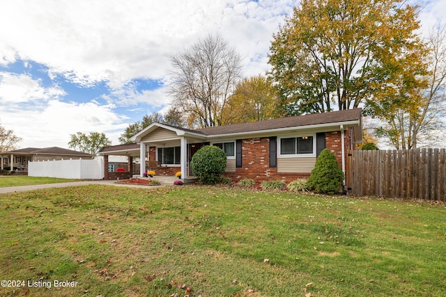 ranch-style home with a front yard