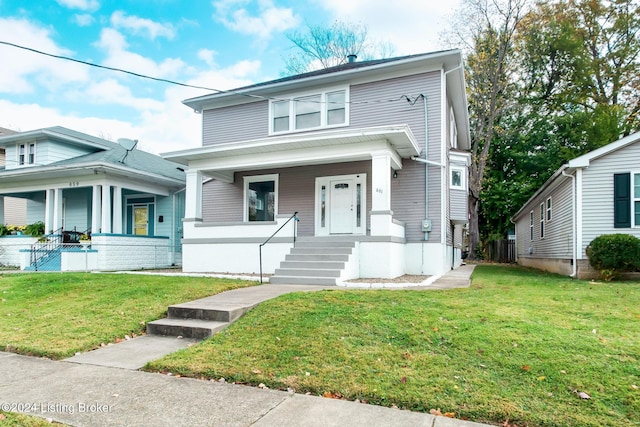 view of front of home featuring a front yard and covered porch