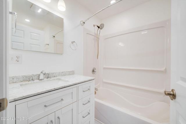 bathroom with vanity and bathtub / shower combination