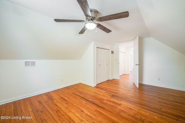 bonus room featuring hardwood / wood-style flooring, vaulted ceiling, and ceiling fan