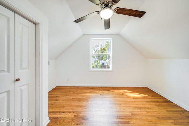 additional living space with lofted ceiling and light wood-type flooring