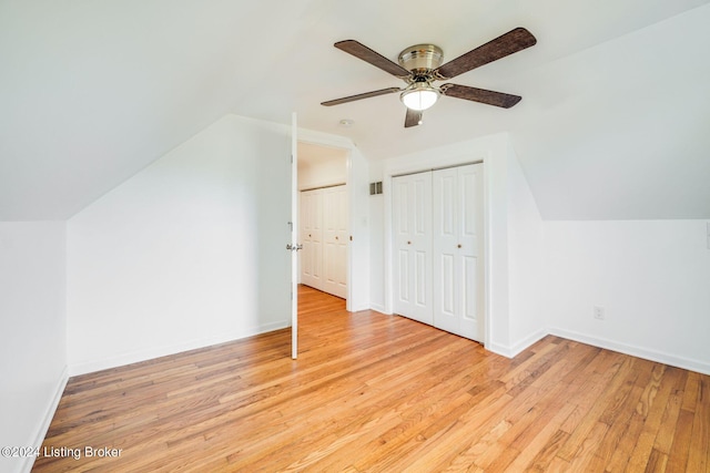 additional living space featuring vaulted ceiling, light hardwood / wood-style floors, and ceiling fan