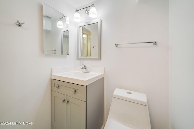 bathroom featuring vanity and toilet