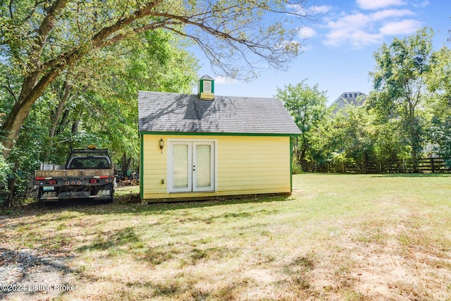 view of outbuilding with a lawn