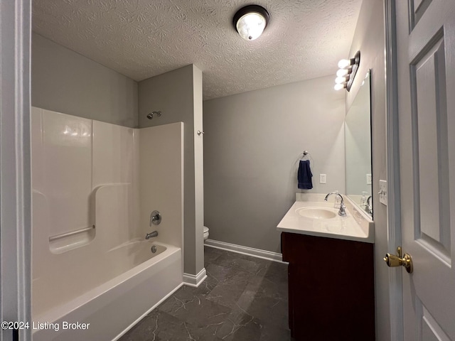 full bathroom with toilet, shower / tub combination, vanity, and a textured ceiling