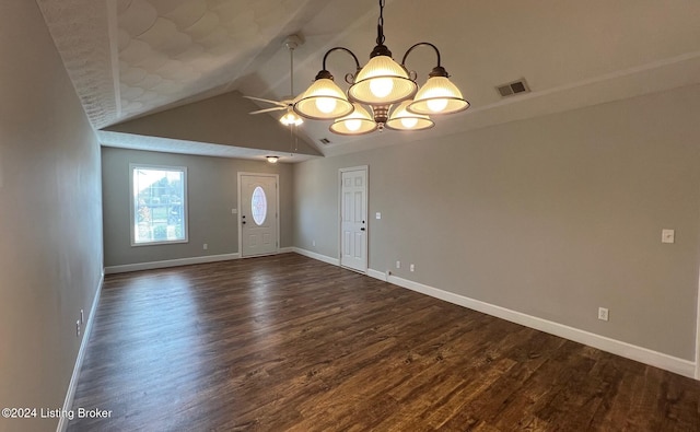 empty room with dark hardwood / wood-style flooring, ceiling fan, and vaulted ceiling