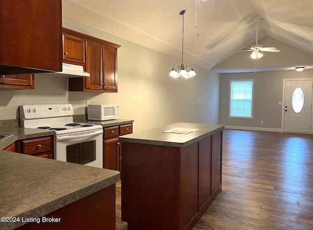 kitchen featuring ceiling fan with notable chandelier, white appliances, a kitchen island, lofted ceiling, and dark wood-type flooring