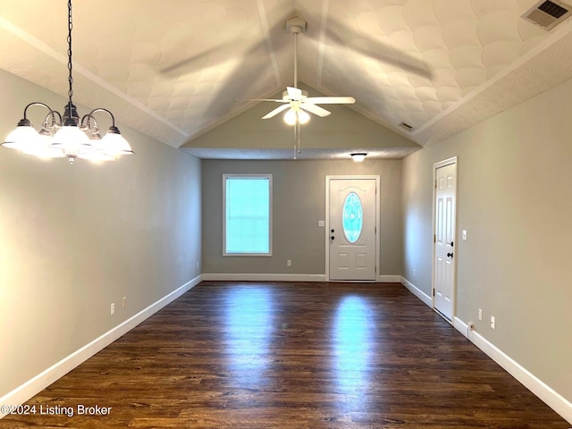 foyer featuring ceiling fan with notable chandelier, dark wood-type flooring, and vaulted ceiling