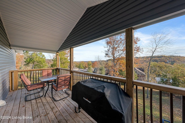 wooden deck with grilling area