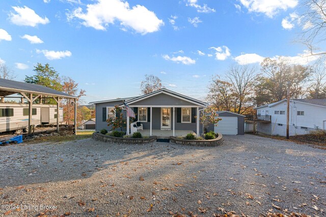 22 Harmony Ln, Clarkson, KY 42726 - view of front facade with a porch and an outbuilding