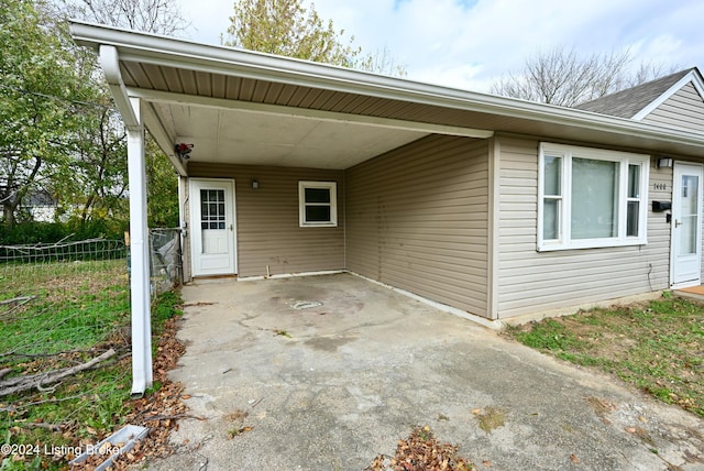 exterior space featuring a carport