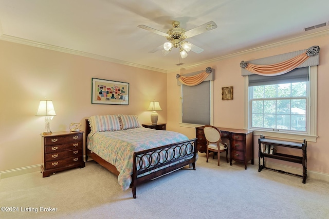 carpeted bedroom featuring ceiling fan and crown molding