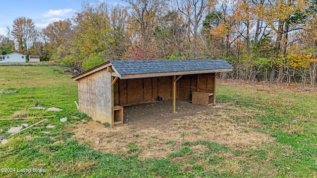 view of outdoor structure with a lawn