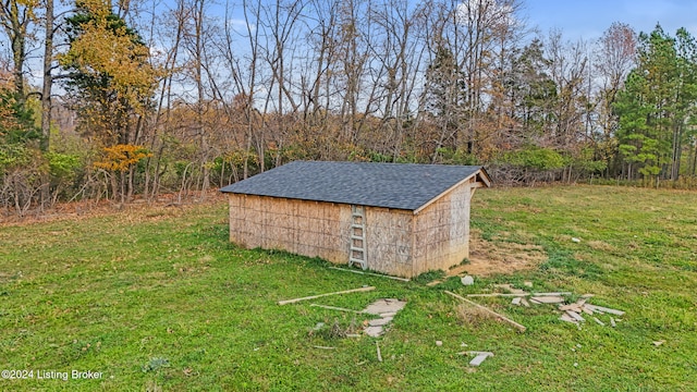 view of outbuilding featuring a lawn