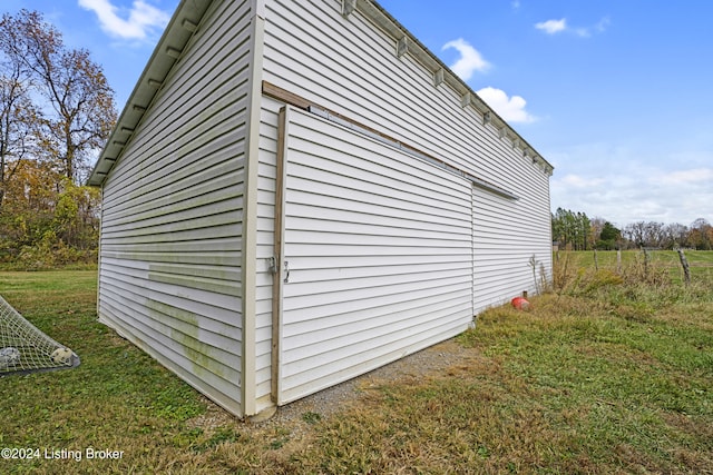 view of home's exterior featuring a yard