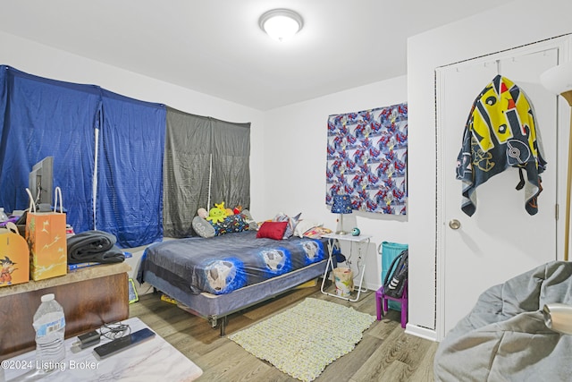 bedroom featuring hardwood / wood-style floors