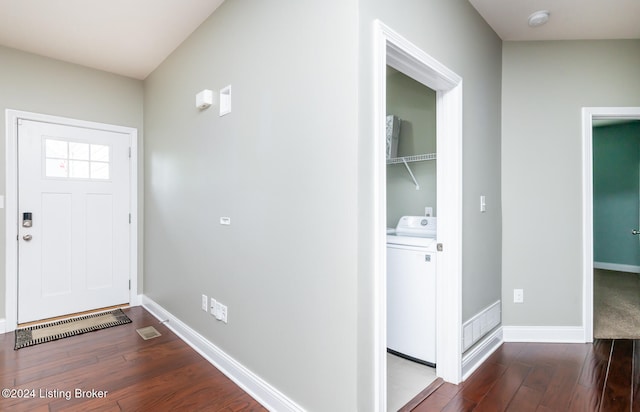 foyer with hardwood / wood-style floors and washer / dryer