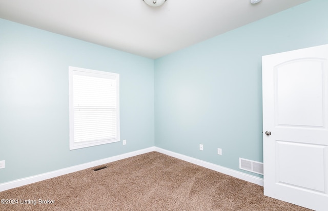 unfurnished room with carpet floors