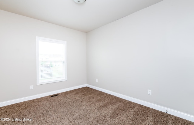 spare room with carpet floors