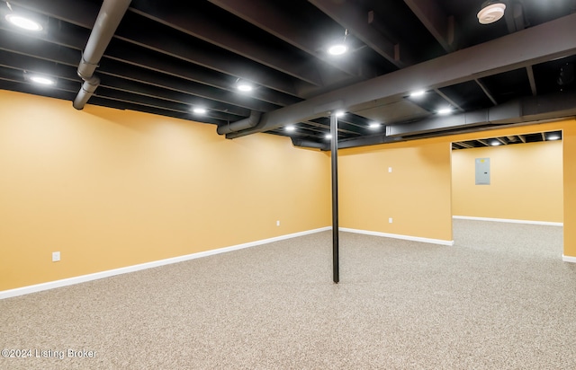 basement featuring electric panel and carpet flooring