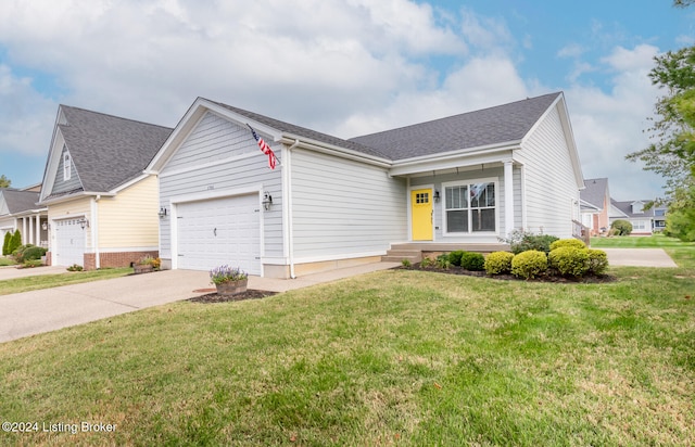 view of front of home featuring a garage and a front yard