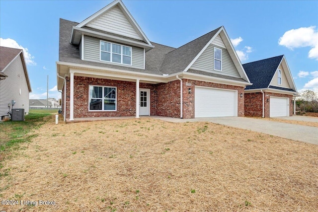 view of front of home with a front lawn and a garage