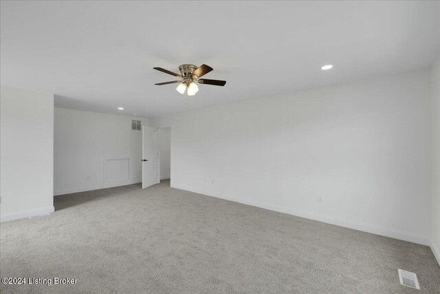 carpeted empty room with ceiling fan