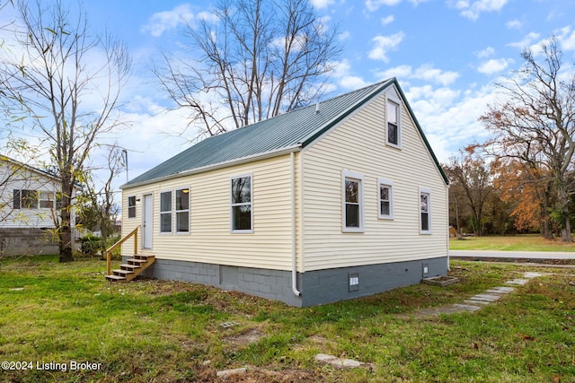 view of property exterior featuring a yard