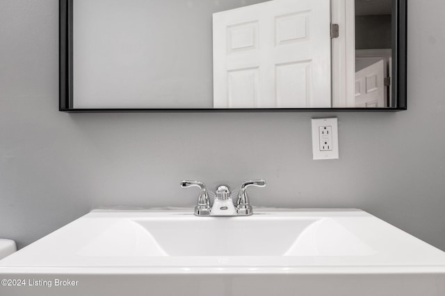 room details featuring toilet and sink