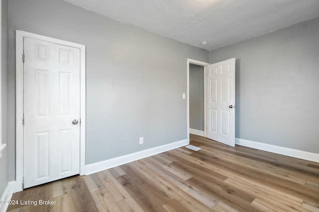 unfurnished bedroom with light hardwood / wood-style flooring