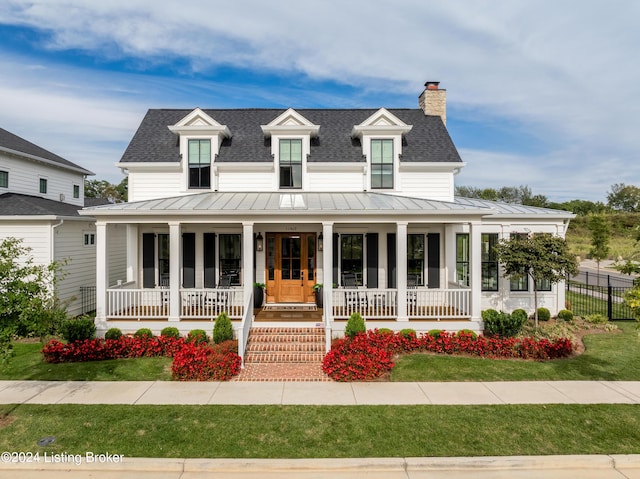 view of front of home featuring a porch and a front yard