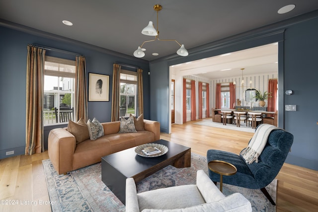 living room with hardwood / wood-style flooring and ornamental molding