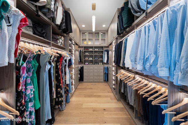 spacious closet featuring light wood-type flooring