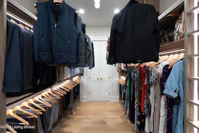 walk in closet featuring light hardwood / wood-style flooring