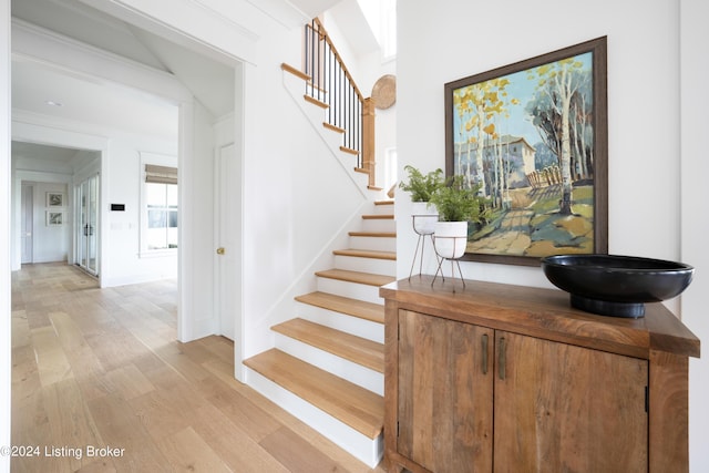 stairway with hardwood / wood-style flooring