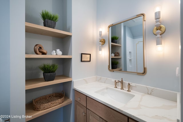 bathroom featuring built in features and vanity