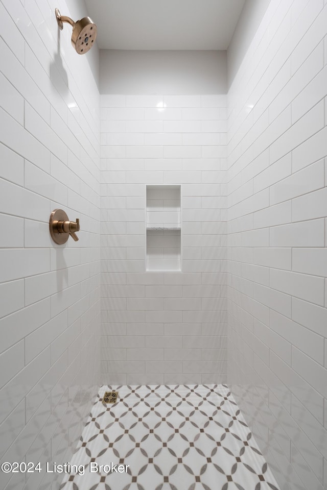 bathroom with a tile shower