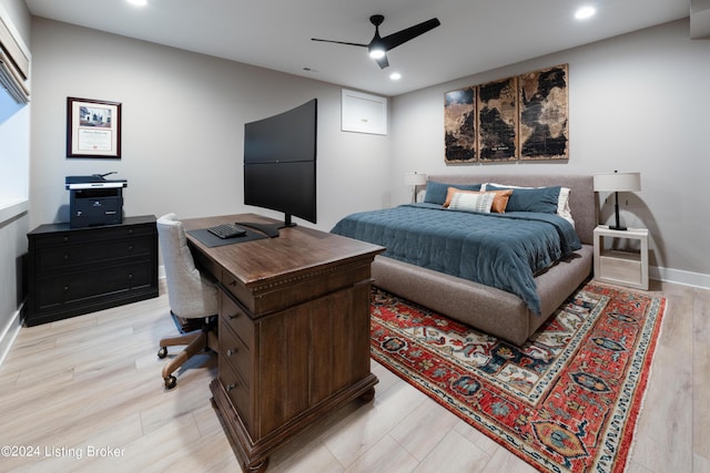 bedroom with light hardwood / wood-style flooring and ceiling fan