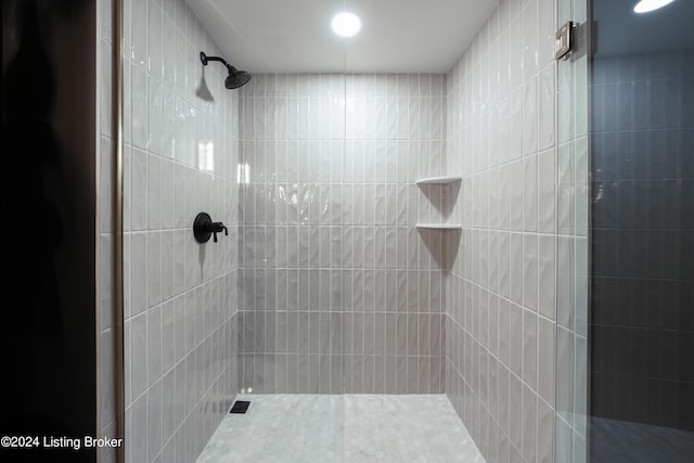 bathroom with tiled shower