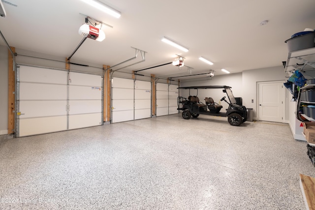 garage featuring a garage door opener