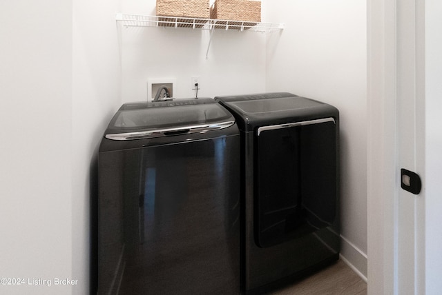 washroom with washer and dryer