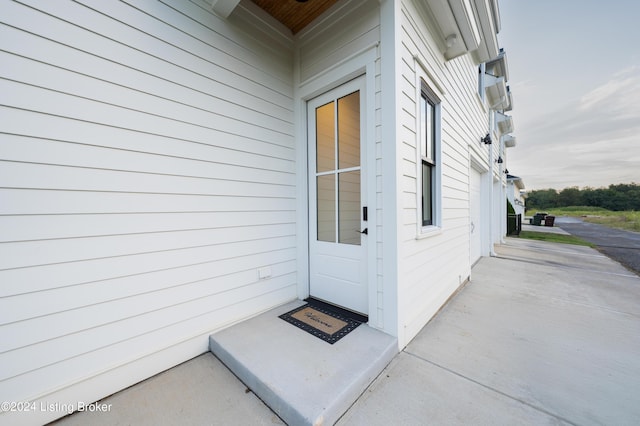 doorway to property with a patio area