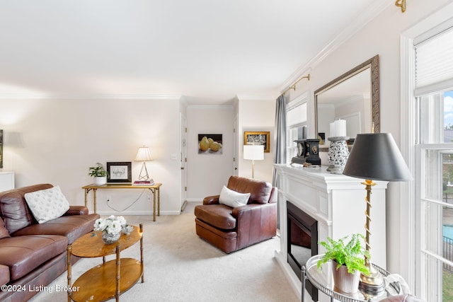 carpeted living room with a healthy amount of sunlight and crown molding