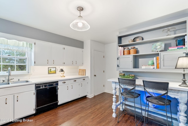 kitchen featuring sink, hanging light fixtures, white cabinets, dark wood-type flooring, and dishwasher