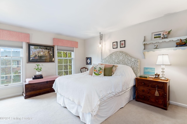 bedroom featuring light carpet