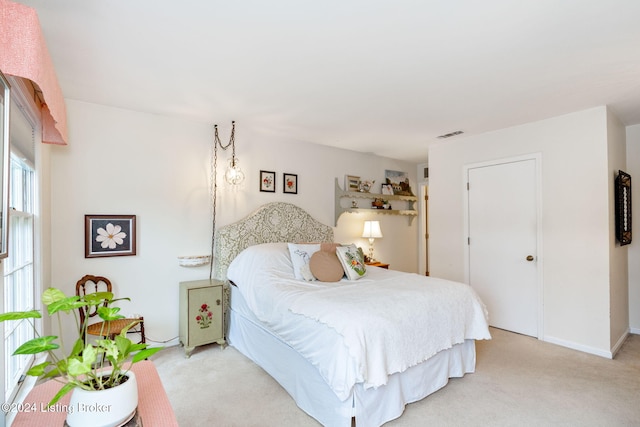 bedroom with light carpet