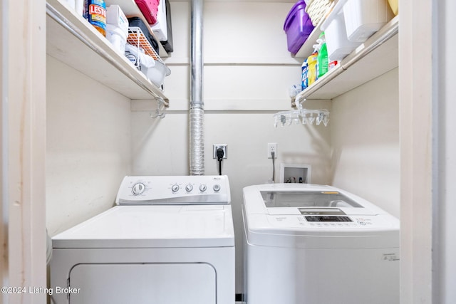 washroom with independent washer and dryer